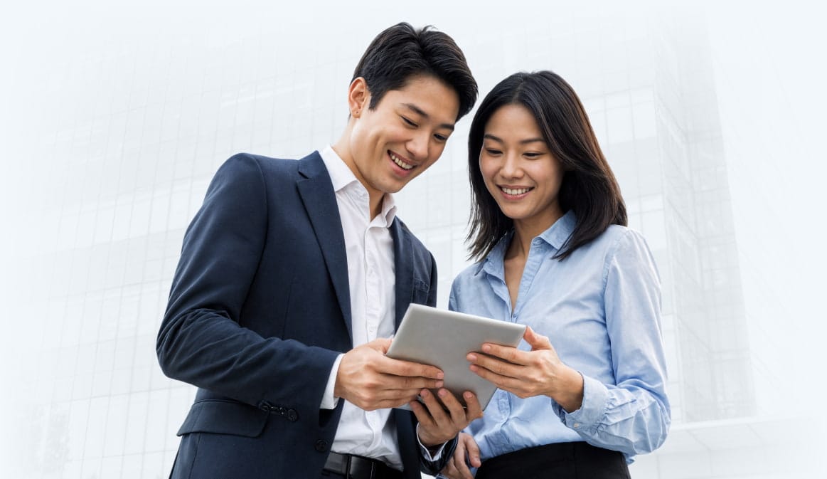 Bankers looking at a tablet